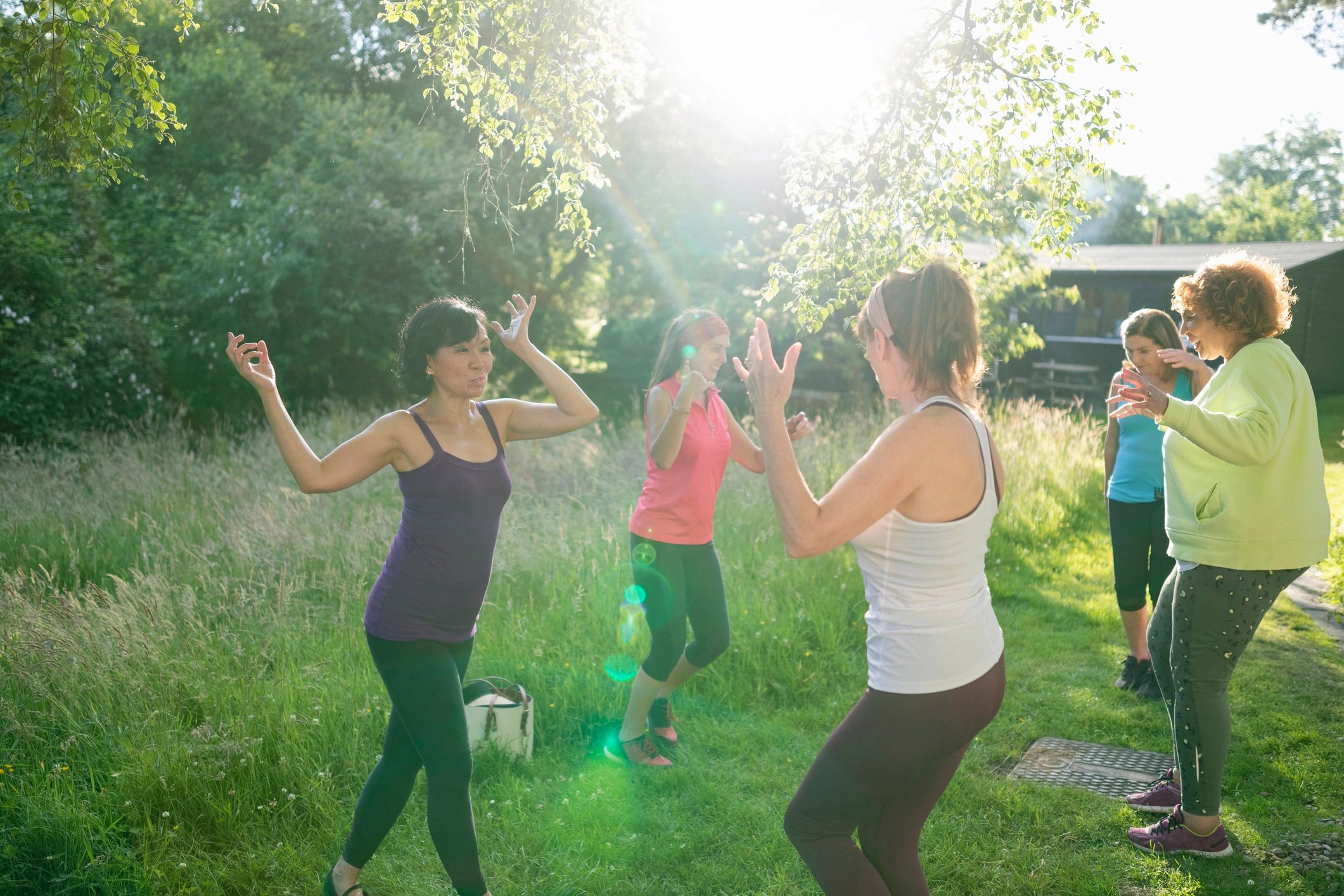 Women moving joyfully together outdoors