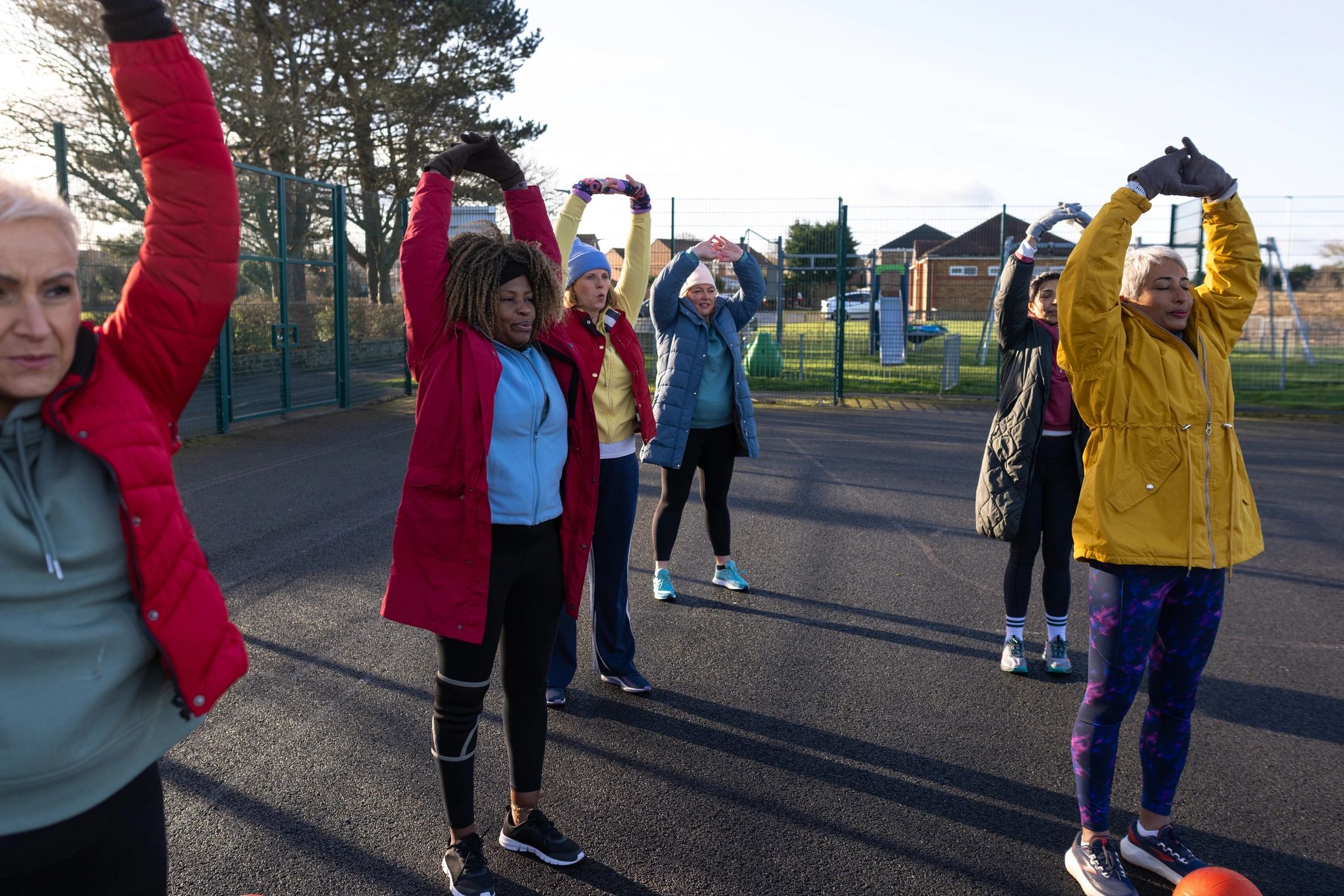 Women participating in an outdoor wellness movement session
