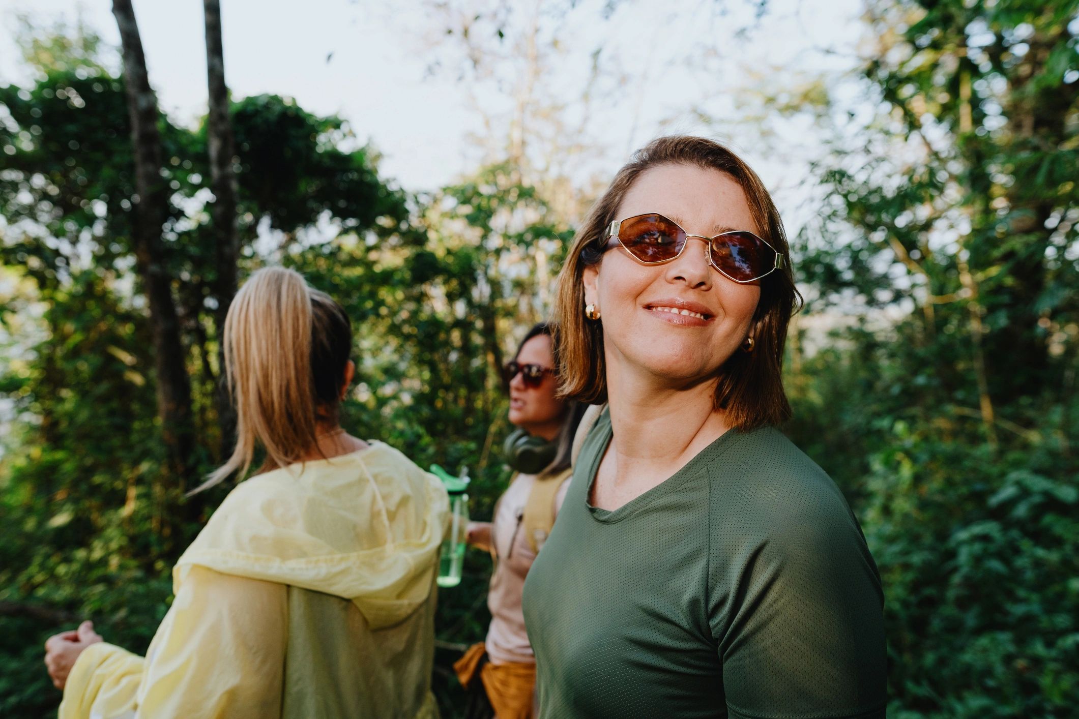Smiling woman on a forest trail
