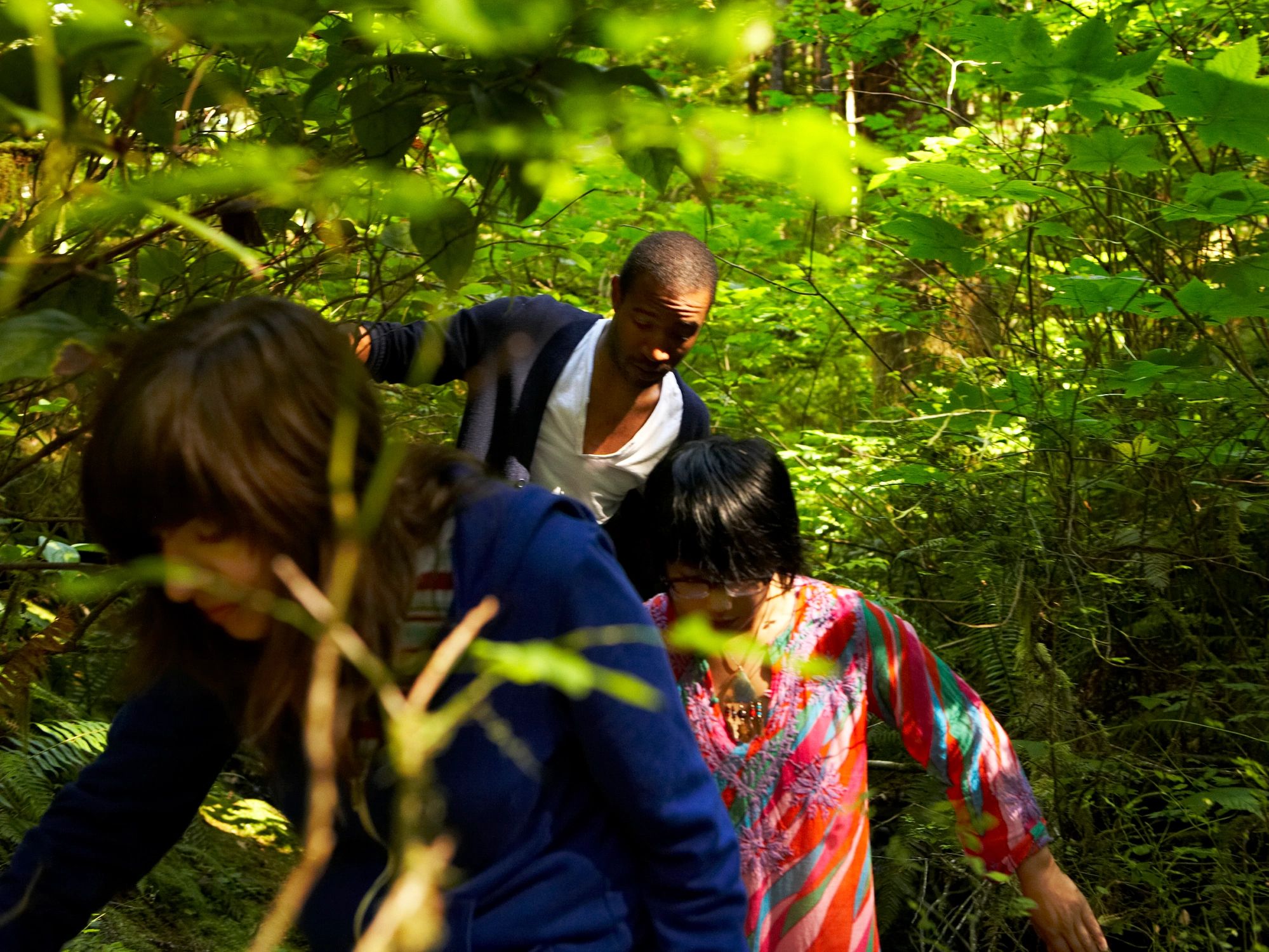Women walking through a forest path on retreat
